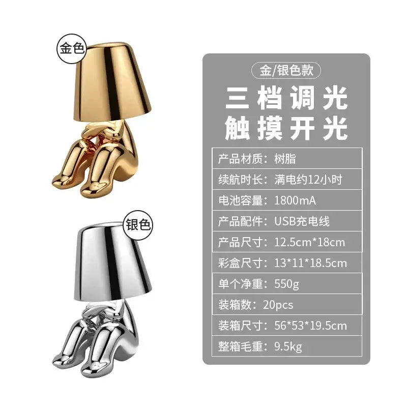 Golden boy table lamp by decorbites led golden featuring a glossy resin seated figure design with rechargeable led light