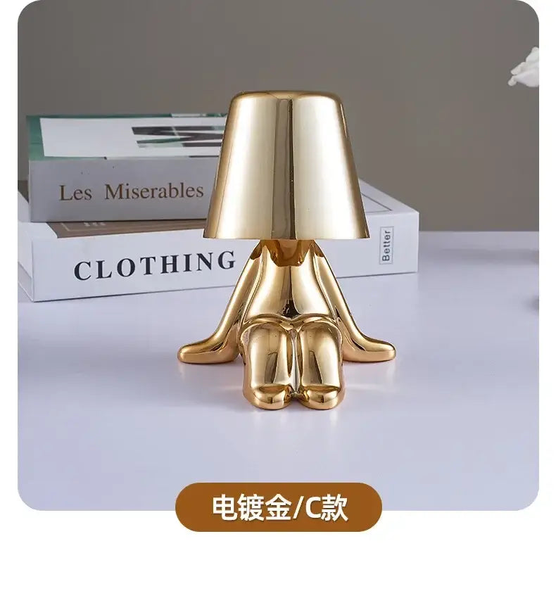 Decorbites led golden boy table lamp in electroplated resin with rechargeable LED golden minimalist design