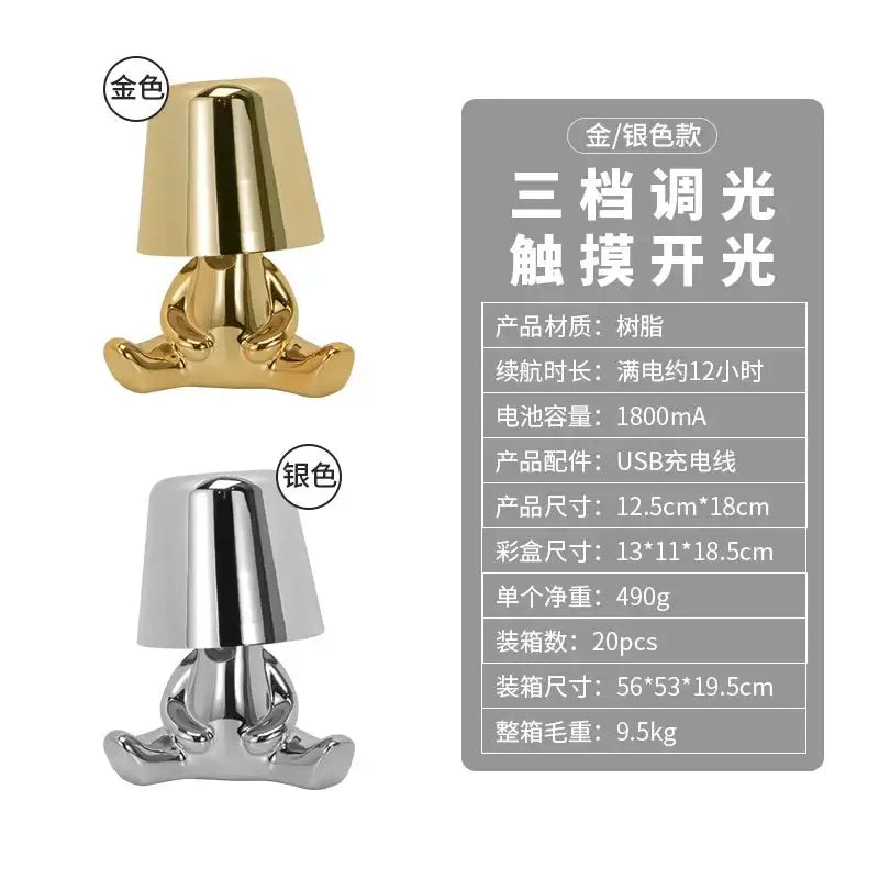 Gold-colored glossy resin decorbites led golden boy table lamp shaped as seated figure with bell-shaped shade for bedroom decor