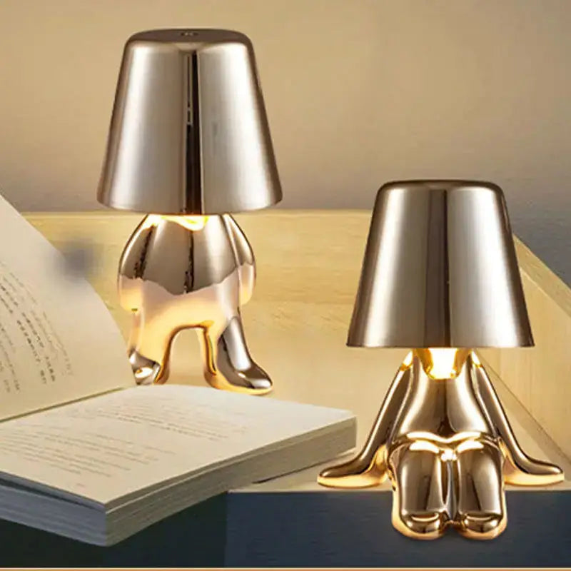 Decorbites led golden boy table lamp with a gold metallic resin humanoid base and inverted conical shade for bedroom decor