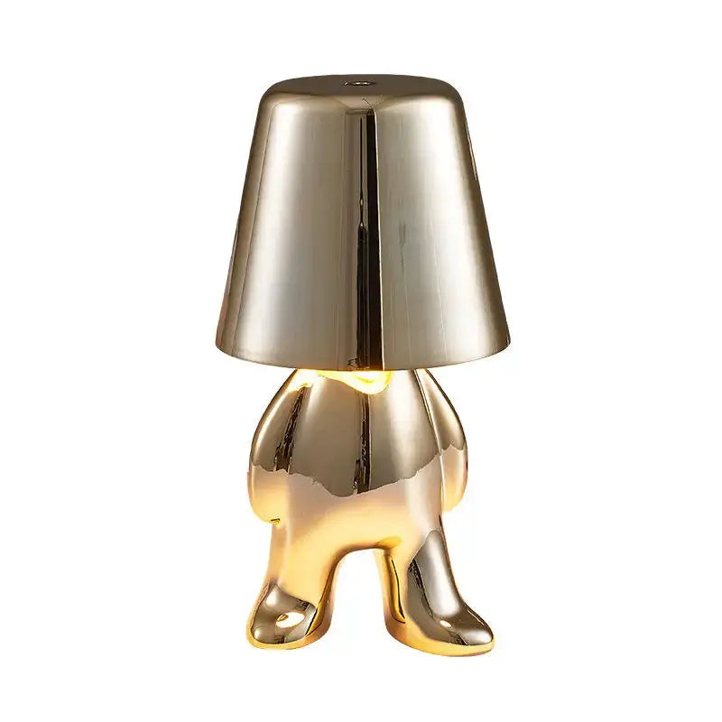 Gold-colored glossy resin decorbites led golden boy table lamp with inverted cone shade for bedroom decor lighting