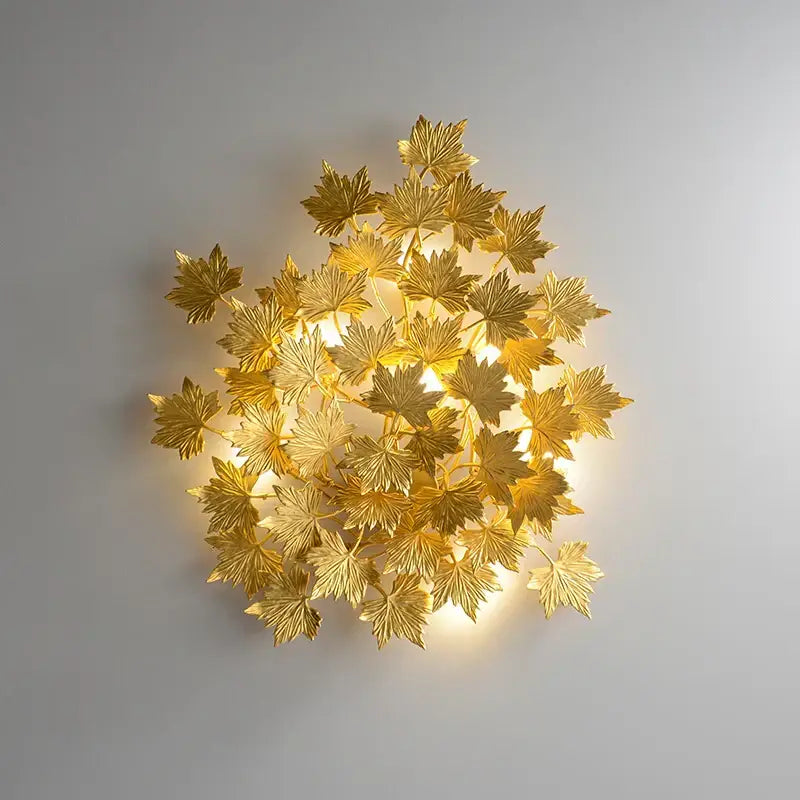 DecorBites led golden maple wall sconce with intricate leaf design and warm ambient lighting for bedroom and corridor