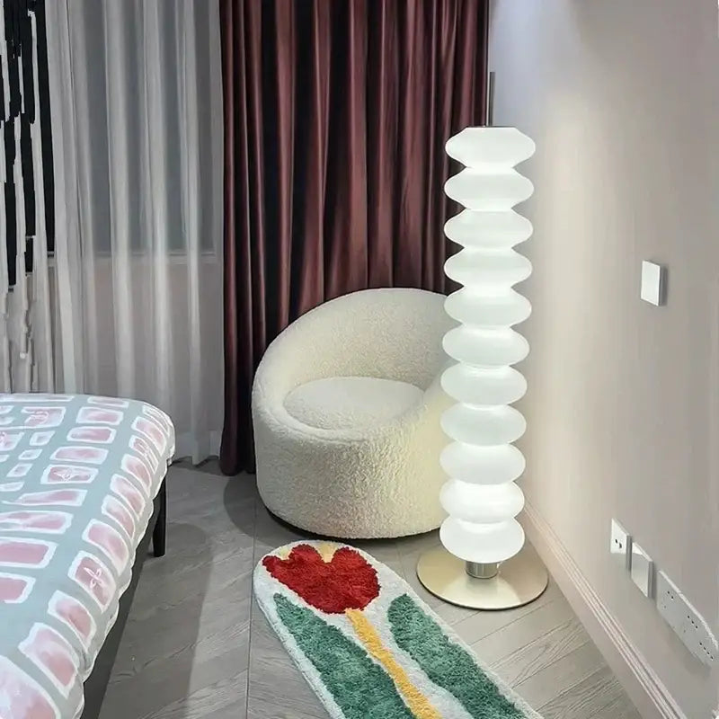 A modern decorbites led gourd sanding floor lamp with white translucent oval segments for living room and bedroom use