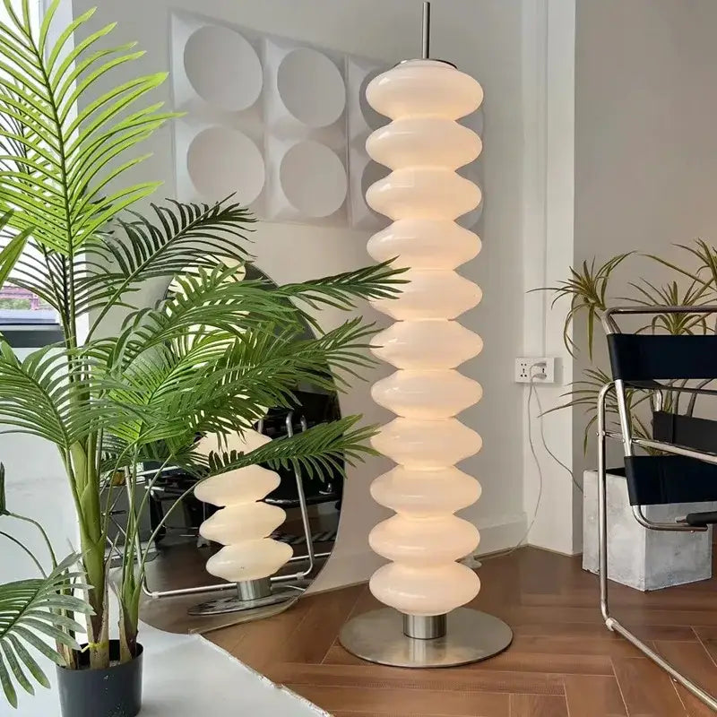 A tall decorbites led gourd sanding floor lamp with stacked off-white glass segments and a metallic base for living room