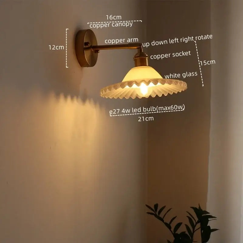 A warm-toned wall light with copper finish and white fluted glass shade for bedroom and living room by DecorBites led green