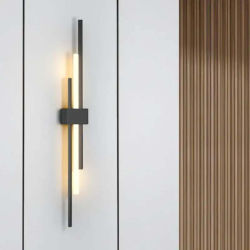 Modern black metal wall lamp with vertical illuminated bar and minimalist design from DecorBites LED grille collection