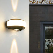 Modern black decorbites led wall sconce with curved design and frosted glass diffuser for staircase and balcony lighting