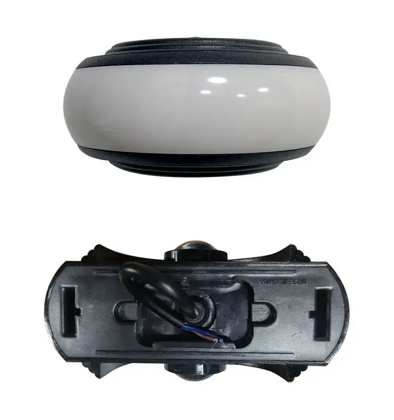 Decorbites led wall sconce featuring a black and white glossy plastic rearview mirror as a wall lamp for staircase lighting