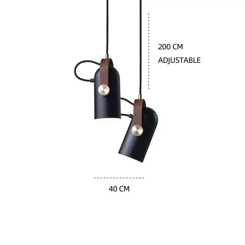 Black cylindrical pendant light with brown leather straps and brass accents by DecorBites led hanging lamp for dining room