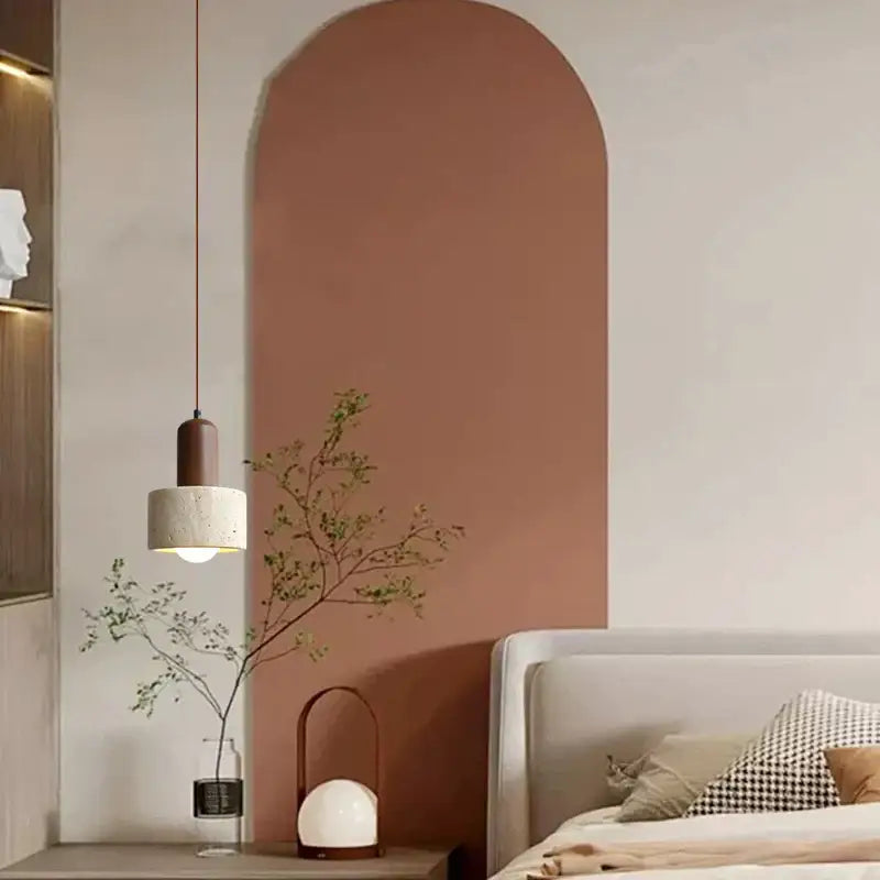 A decorbites led hanging lamp with a matte brown top and textured off-white cylindrical shade for kitchen cafe lighting