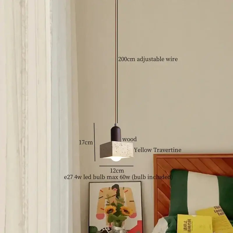 A modern decorbites led hanging lamp with a square yellow travertine shade and black wood top for kitchen lighting