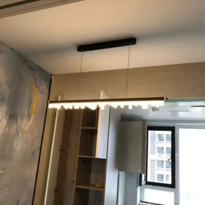 Modern black rectangular pendant lights with sleek minimalist design and evenly spaced LEDs by DecorBites LED hanging lamps