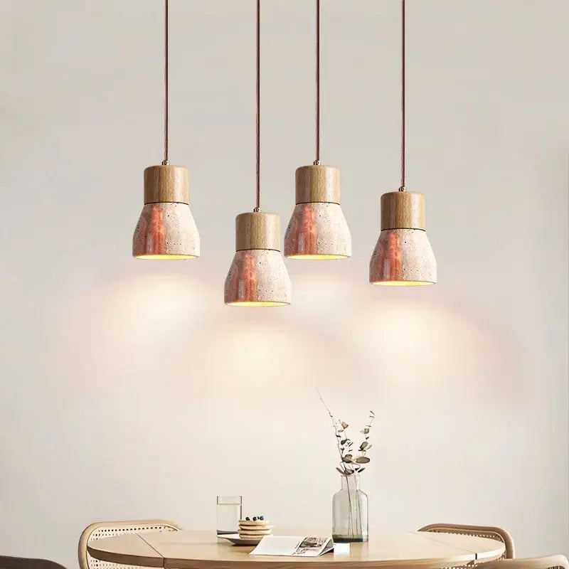 Four decorbites led hanging lamps with wooden tops and yellow travertine speckled concrete shades for living spaces