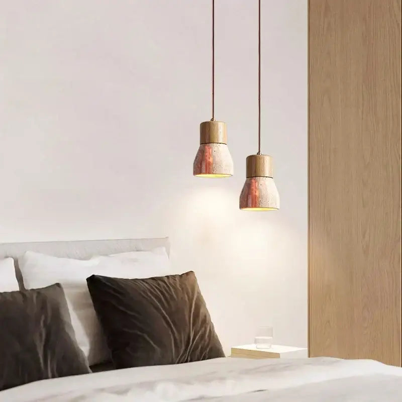 Two decorbites led hanging lamps with yellow travertine textured ceramic shades and wooden tops for living room lighting