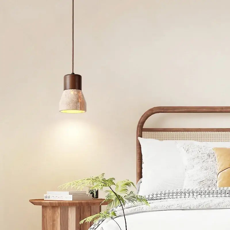 A decorbites led hanging lamp with a matte brown metal top and yellow travertine concrete shade for bedroom and dining