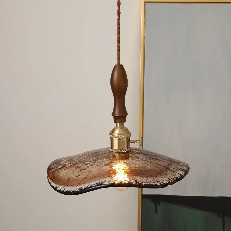 DecorBites led hanging light featuring a rustic copper-toned glass pendant with wooden handle and brass hardware