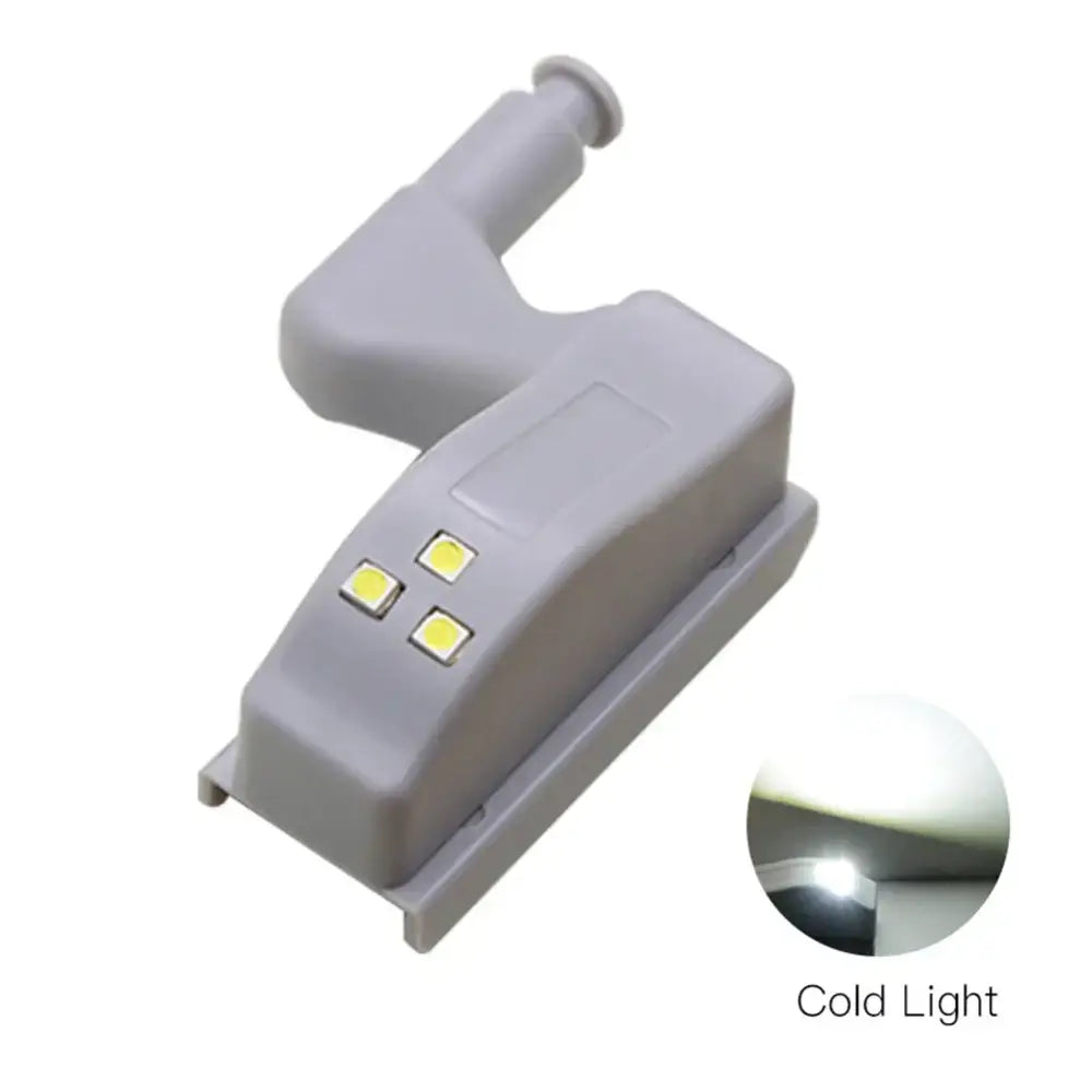 Gray plastic decorbites led hinge sensor light with three yellowish square leds and curved mounting arm for cabinets