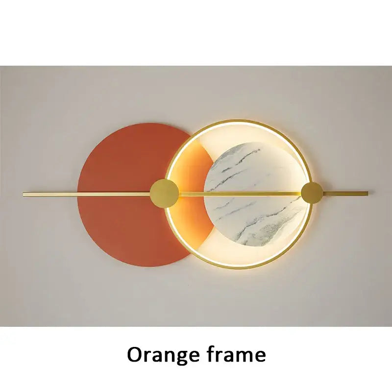 Modern geometric decorbites led home wall lamp with warm orange frame gold accents and illuminated marble disc