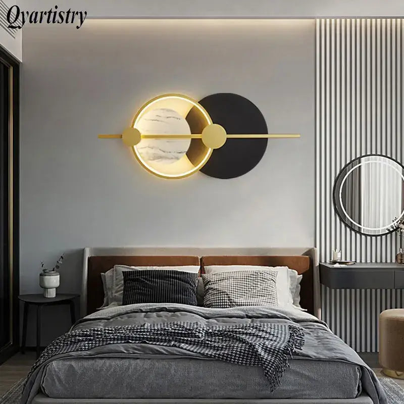 Modern gold-toned DecorBites™ LED home wall lamp with circular marble-effect face and black accent for living room lighting