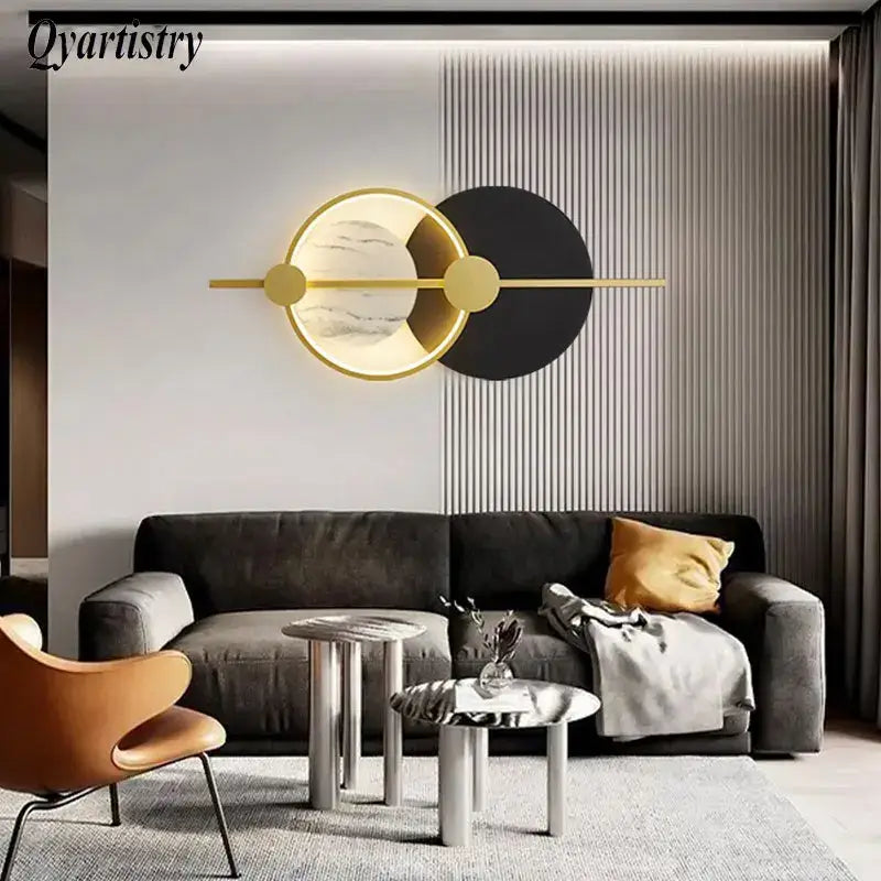 Modern gold-toned decorbites led home wall lamp with circular marble-like and black panels for living room lighting
