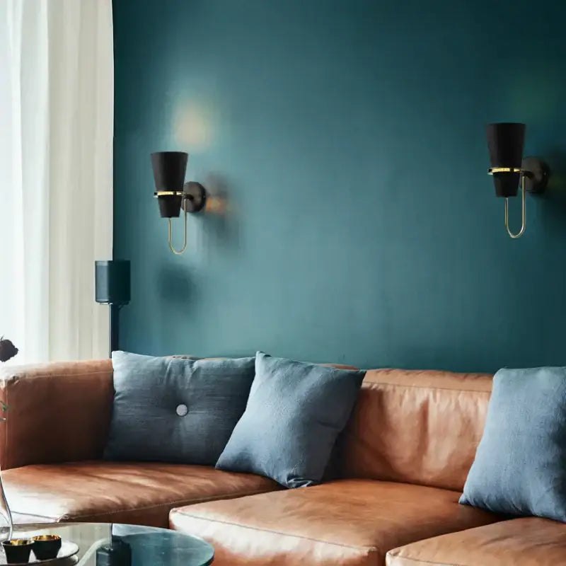 Brown leather sofa with blue cushions beside decorbites led horn wall lamp modern nordic sconce for living room