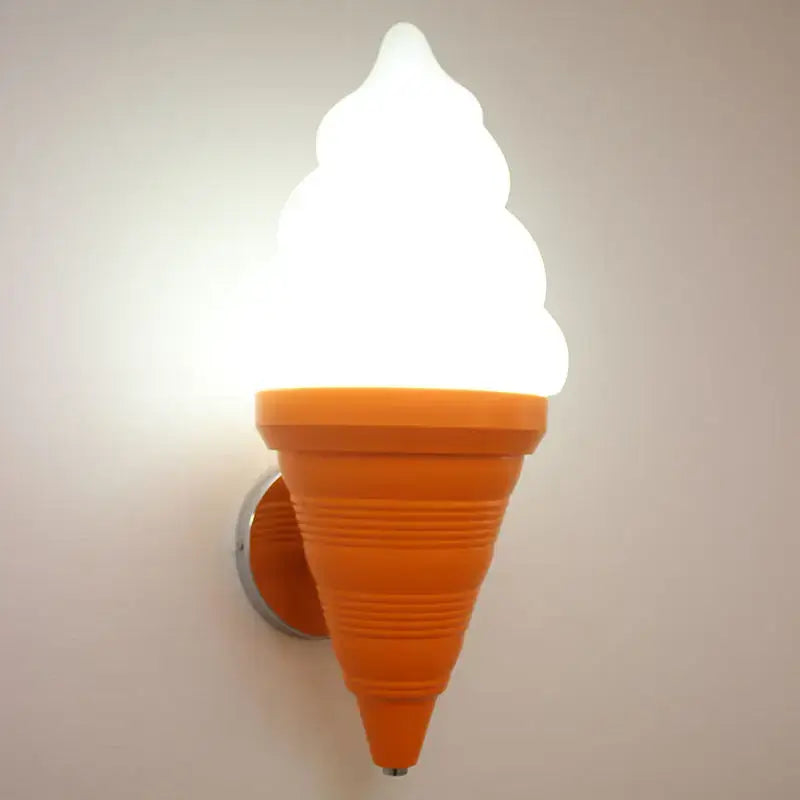 Bright orange DecorBites LED ice cream wall lamp with glowing white swirled top for modern kids bedroom lighting