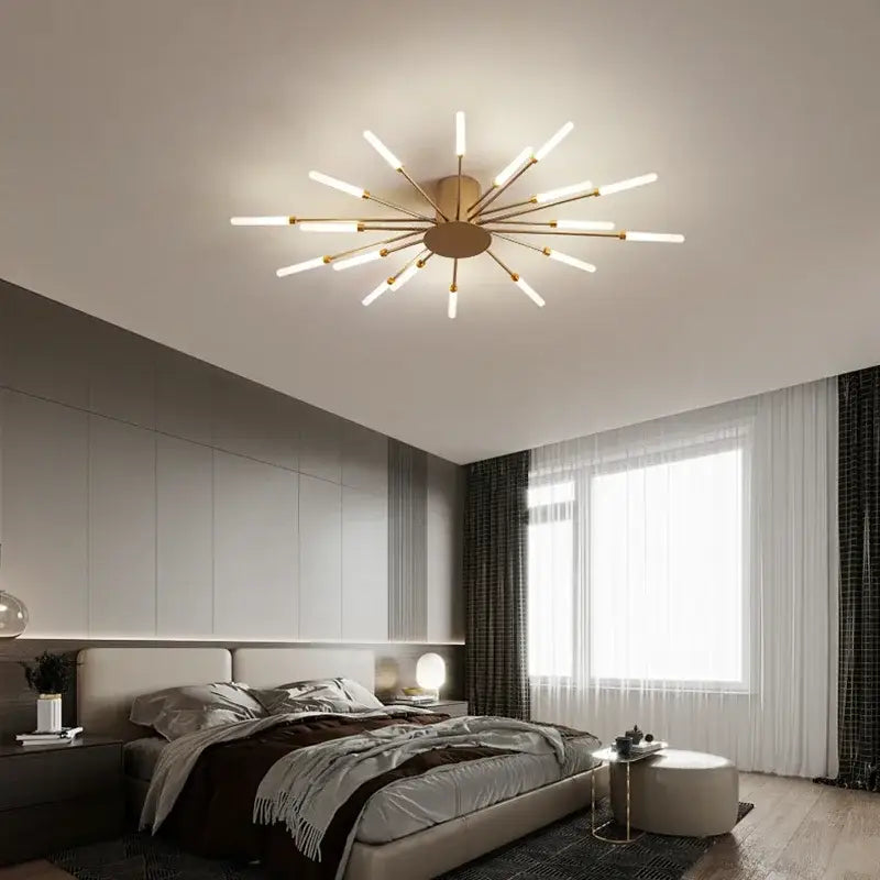 Gold-toned starburst decorbites led indoor ceiling light with slender arms and frosted glass rods for modern living spaces