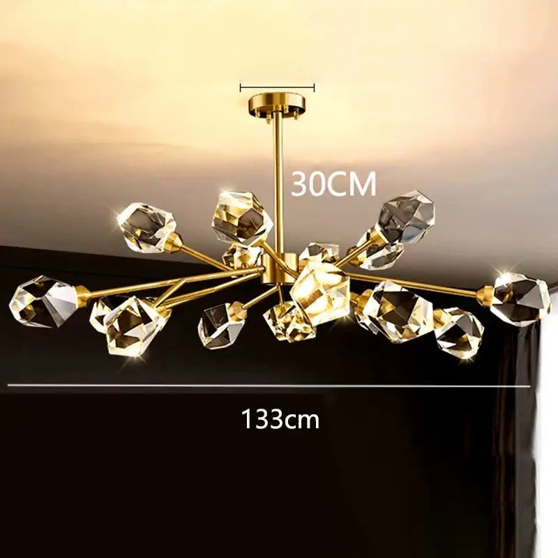 Gold-toned DecorBites LED indoor chandelier with faceted crystal orbs and brass stem for living room lighting