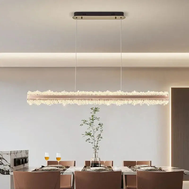 A modern decorbites led indoor chandelier lighting featuring a rose gold frame with cascading crystals for stylish bedrooms