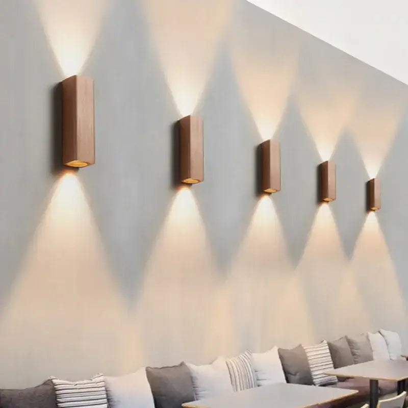 Five sleek rectangular wooden wall lamps with warm lighting by decorbites led indoor for corridor or bedroom use