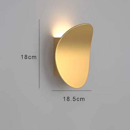 Gold-colored sleek curved decorbites led indoor wall lamp with modern minimalist design for living room and bedside lighting