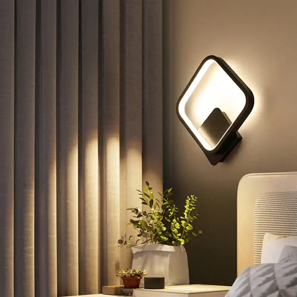 Modern black-framed decorbites led indoor wall light with diamond shape and glowing white panel for home lighting