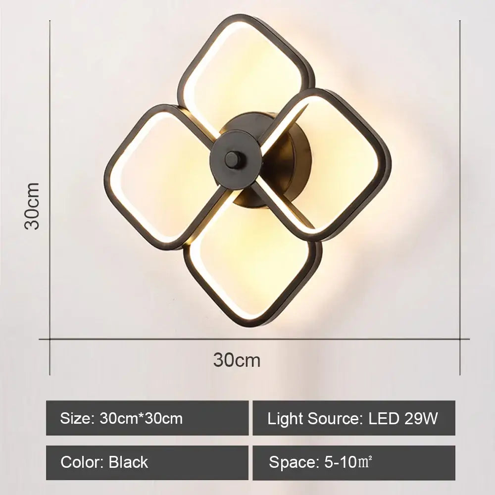 Black modern DecorBites LED indoor wall light with four illuminated square panels in a cross pattern for home lighting