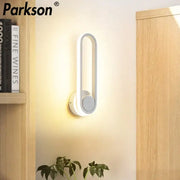 Modern white DecorBites LED indoor wall sconce lamp with sleek curved rectangular design for home bathroom lighting