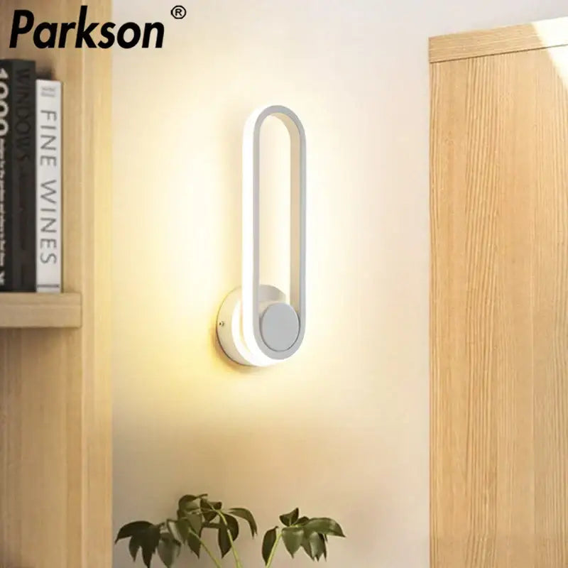 Modern white DecorBites LED indoor wall sconce lamp with sleek curved rectangular design for home bathroom lighting