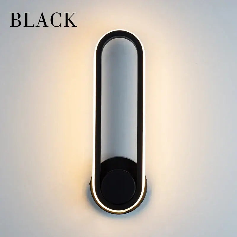 Black modern decorbites led indoor wall lamp with sleek oval design and illuminated led edge lighting for home use