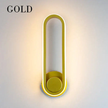 Gold-colored decorbites led indoor wall lamp with sleek elongated oval frame and integrated led lighting for home use