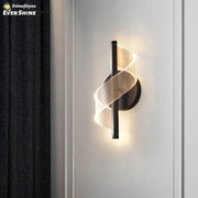 Modern black metal wall sconce light with glowing translucent spiral mesh design for indoor bedroom and living room use