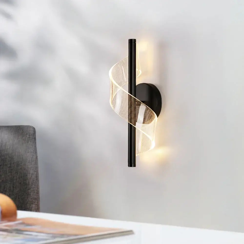 Black decorbites led wall sconce light with sleek spiraling translucent mesh emitting warm light for indoor decor