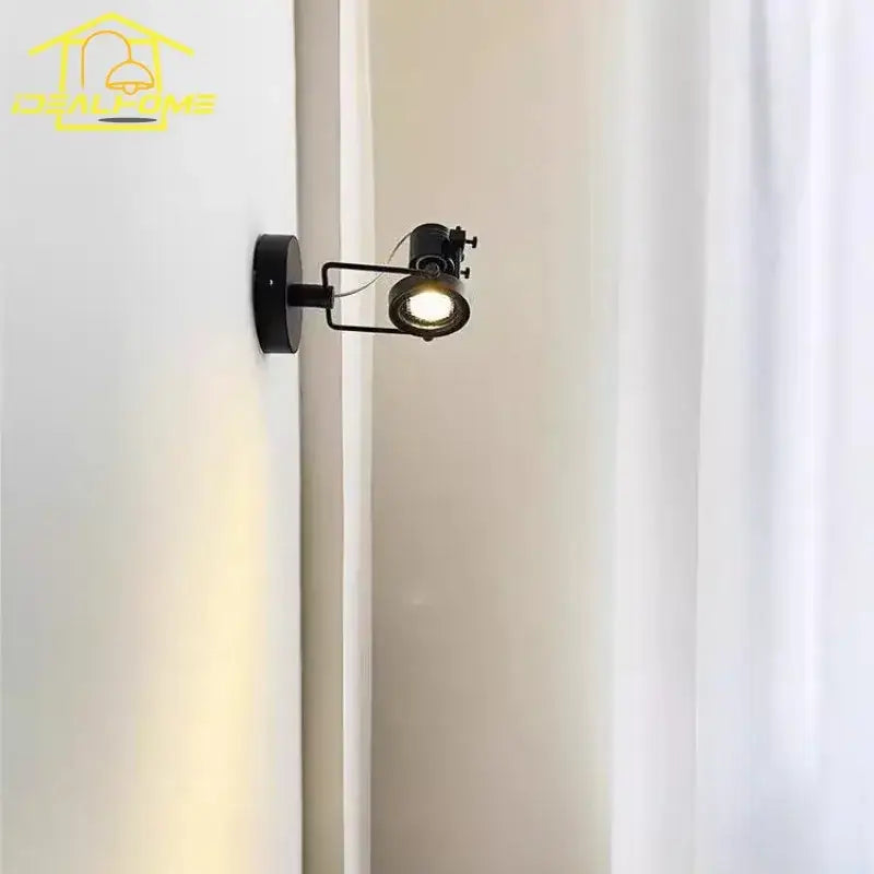 Black metal decorbites led industrial wall lamp with adjustable arm emitting warm light for led industrial bedroom use