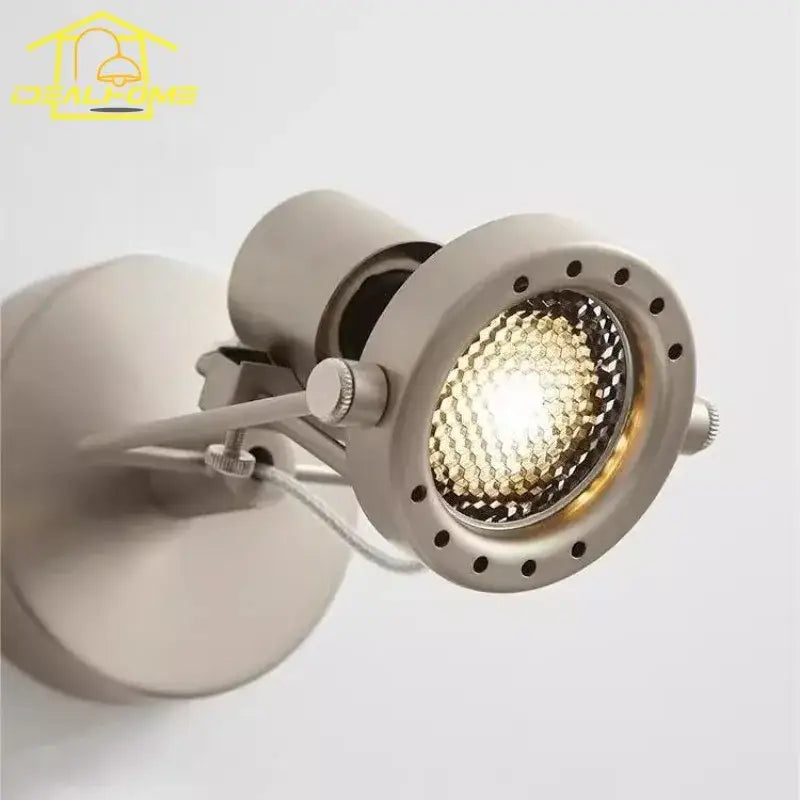 Modern brushed nickel DecorBites LED industrial bedroom wall lamp with adjustable spotlight and visible LED bulb in black nickel