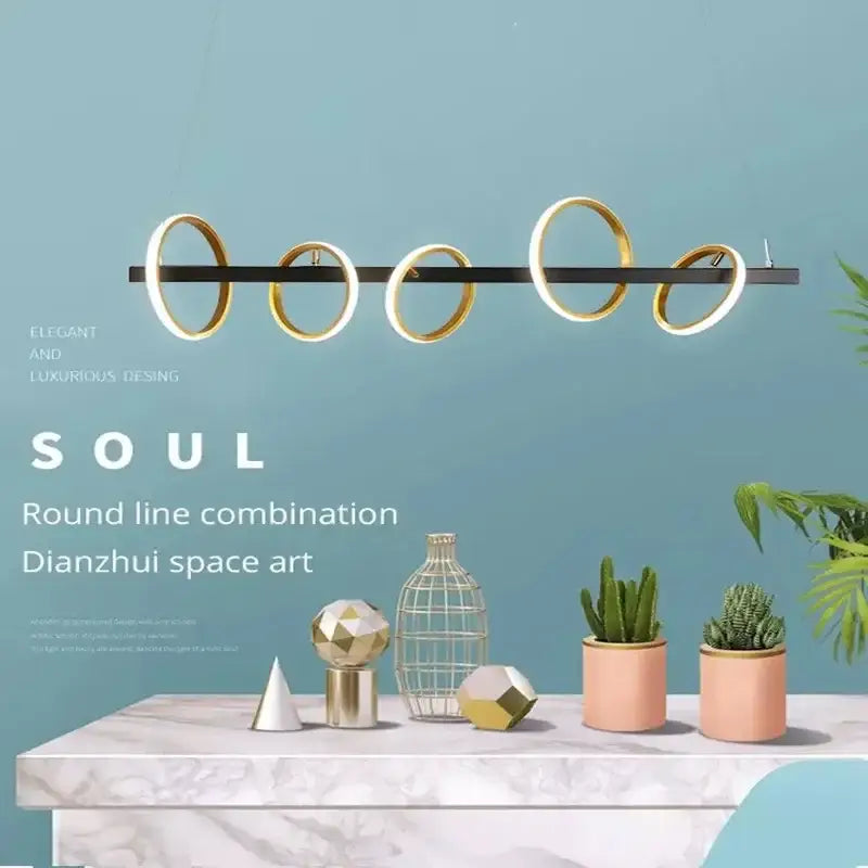 Modern gold-toned decorbites led industrial chandelier with sleek black bar and glowing led rings for dining room use