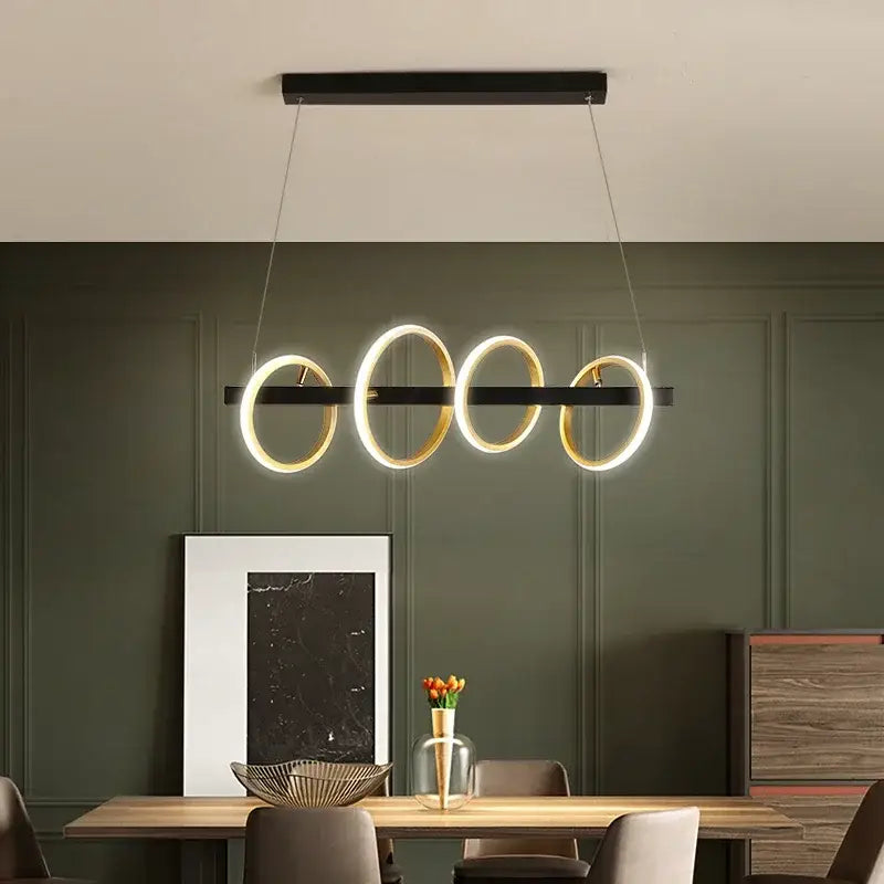 Modern black and gold decorbites led industrial chandelier with four glowing circular rings for dining and living room use