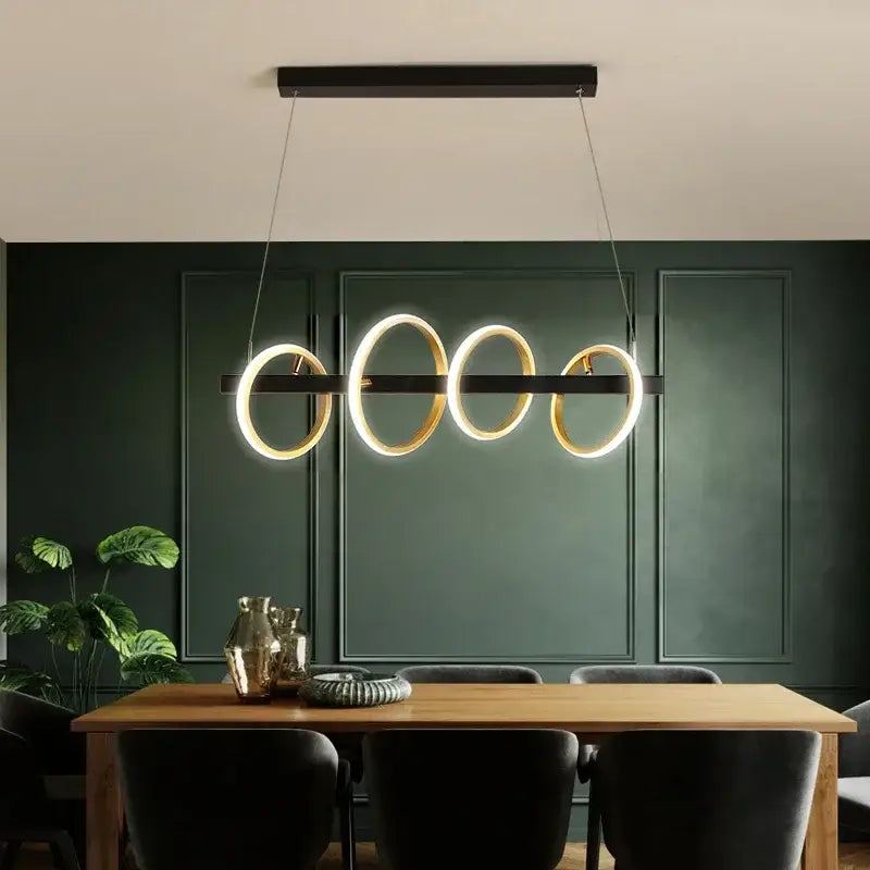 Modern black rectangular decorbites led industrial chandelier with four glowing gold rings for dining and living rooms