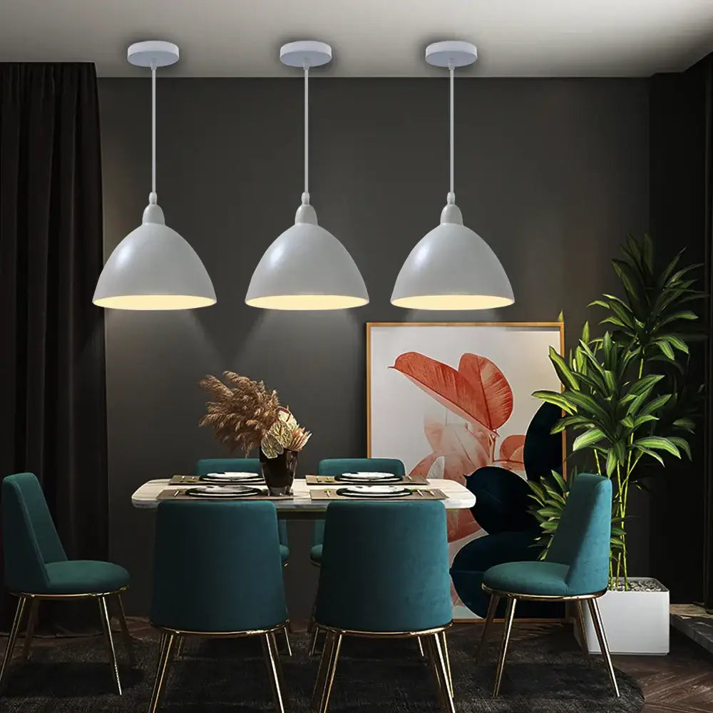Three white dome-shaped decorbites led industrial pendant lamps hang above a dining table for stylish lighting