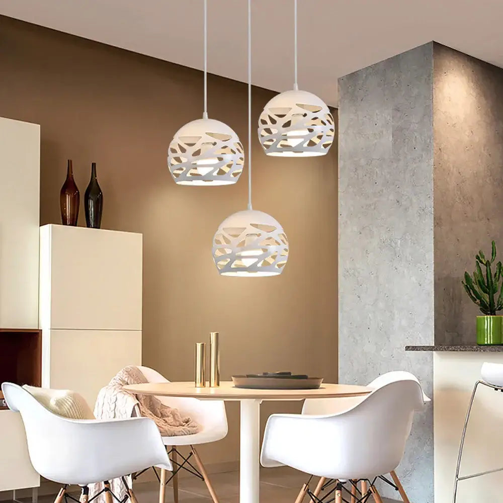 Three white spherical pendant lamps with intricate cut-out patterns by decorbites led industrial for stylish lighting