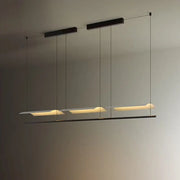 Modern black DecorBites led iron art chandelier with three elongated rectangular panels emitting warm ambient glow