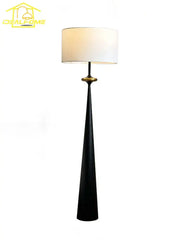 Black tapered floor lamp with white cylindrical shade and gold accent featuring decorbites led iron art design