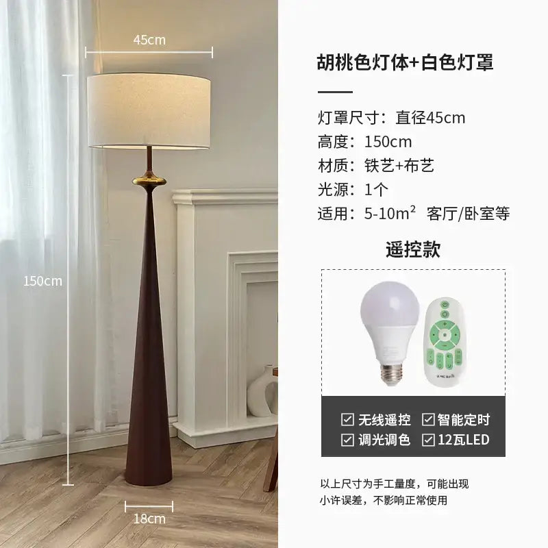 A tall slender floor lamp with dark brown iron base and white shade by decorbites led iron art for living room use