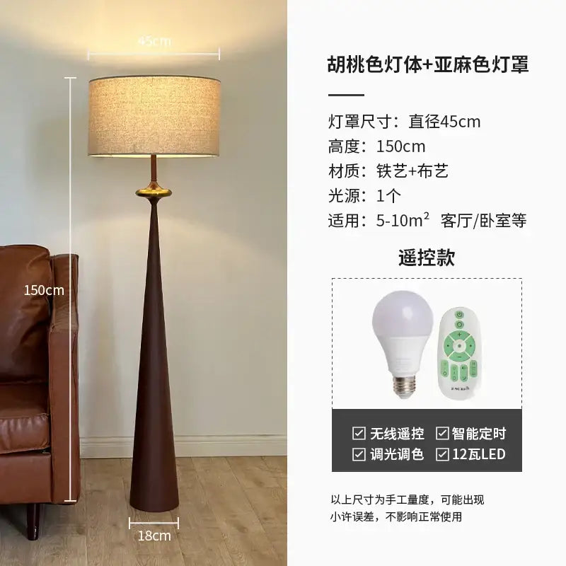 A tall slender floor lamp with a dark brown iron base and beige linen shade from decorbites led iron art collection